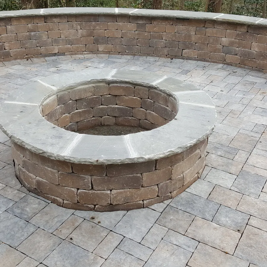 a circular object on a brick surface