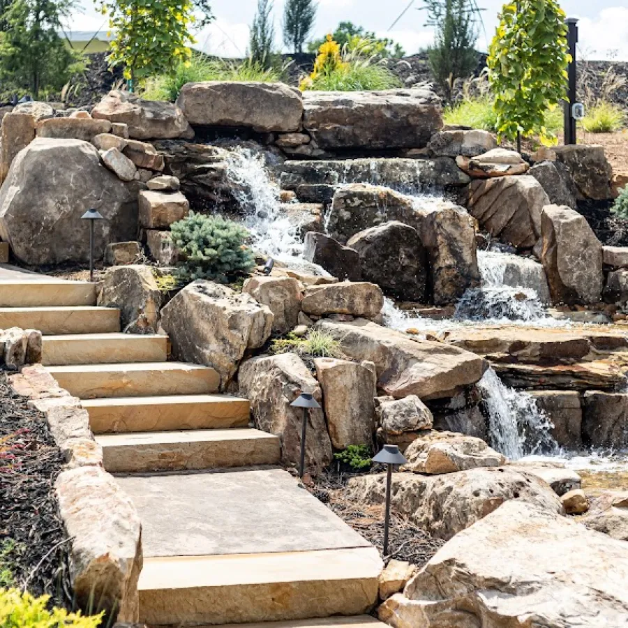 a stone staircase with a waterfall