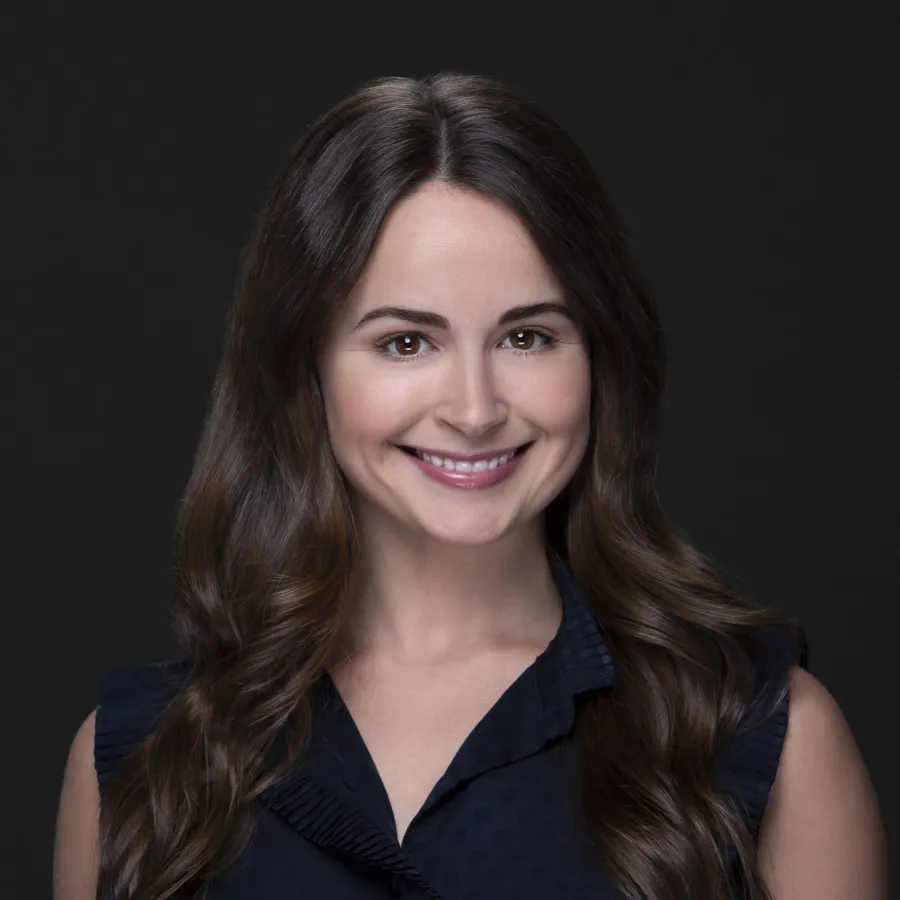 a woman with long hair smiling