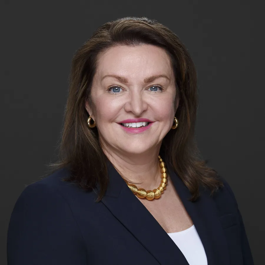 a woman wearing a black suit