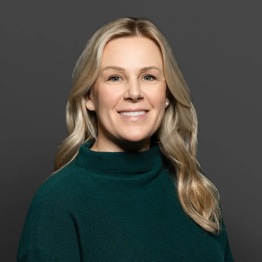 a woman in a green sweater