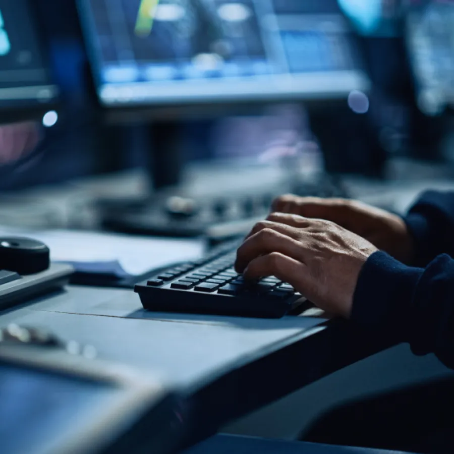 a close-up of a person typing on a keyboard