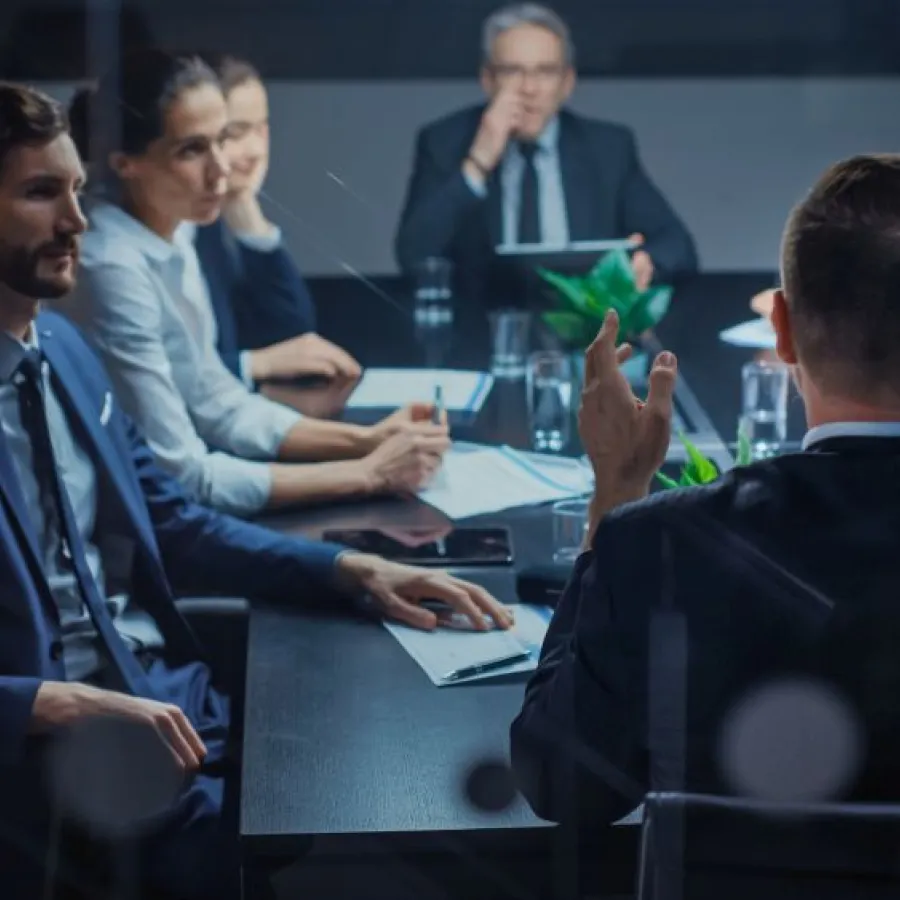 a group of people sitting around a table