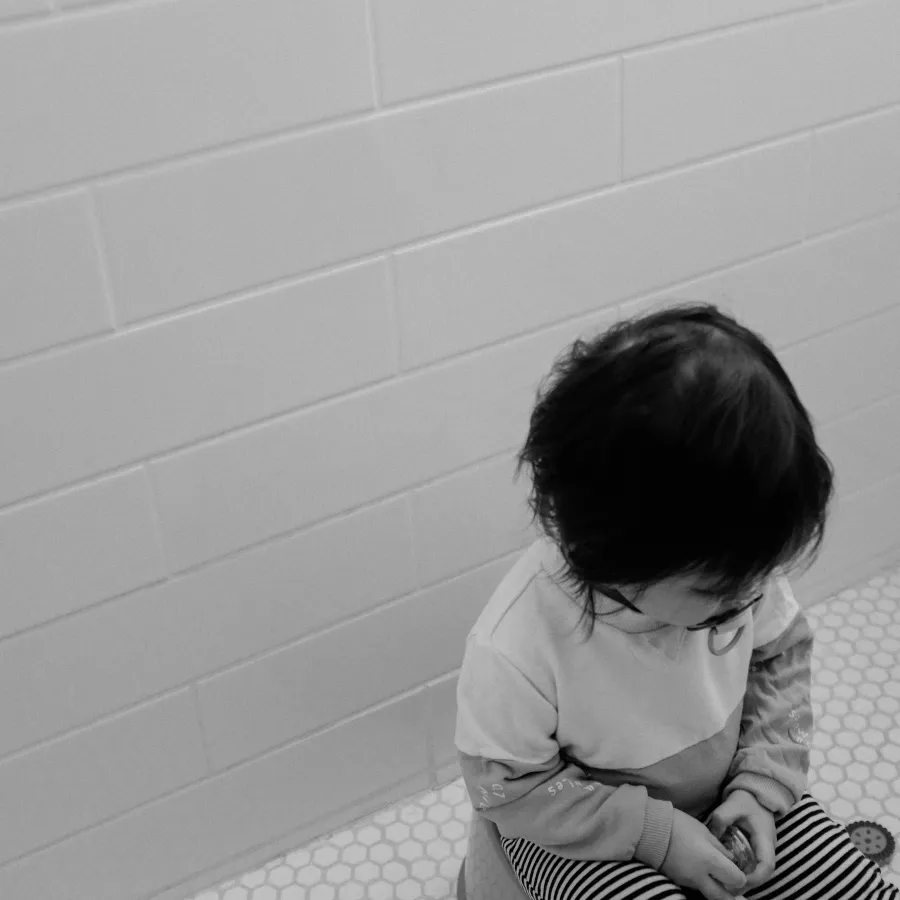 a child sitting on the floor