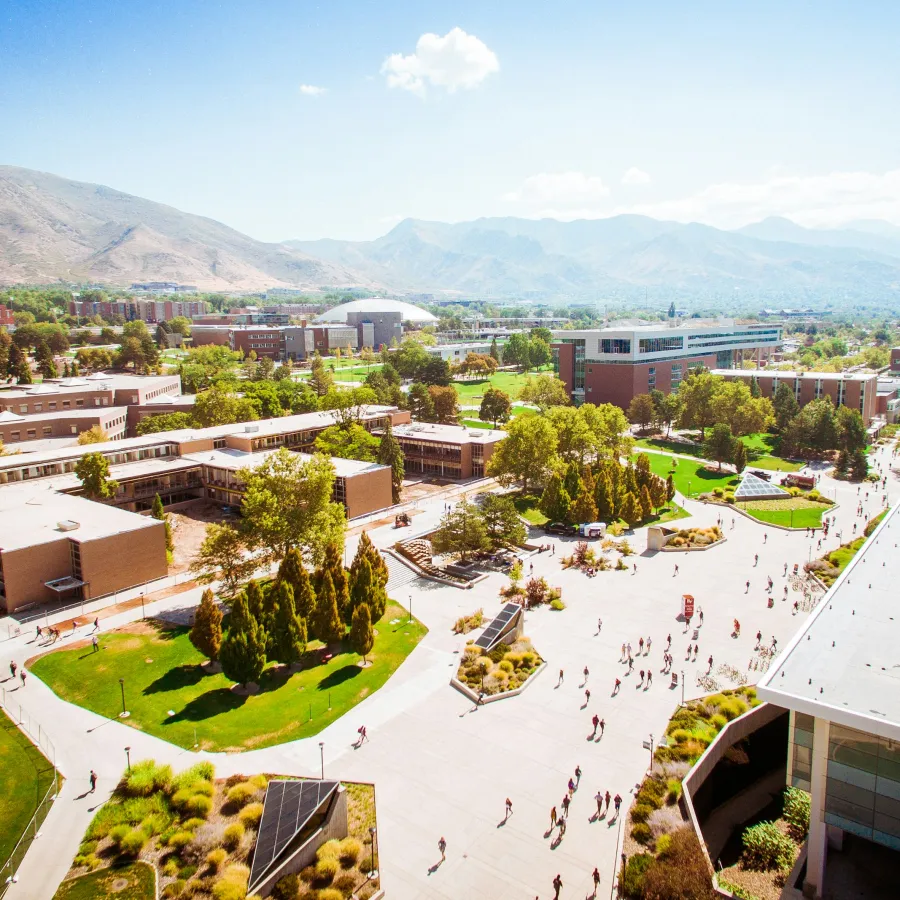 a large courtyard with buildings and trees