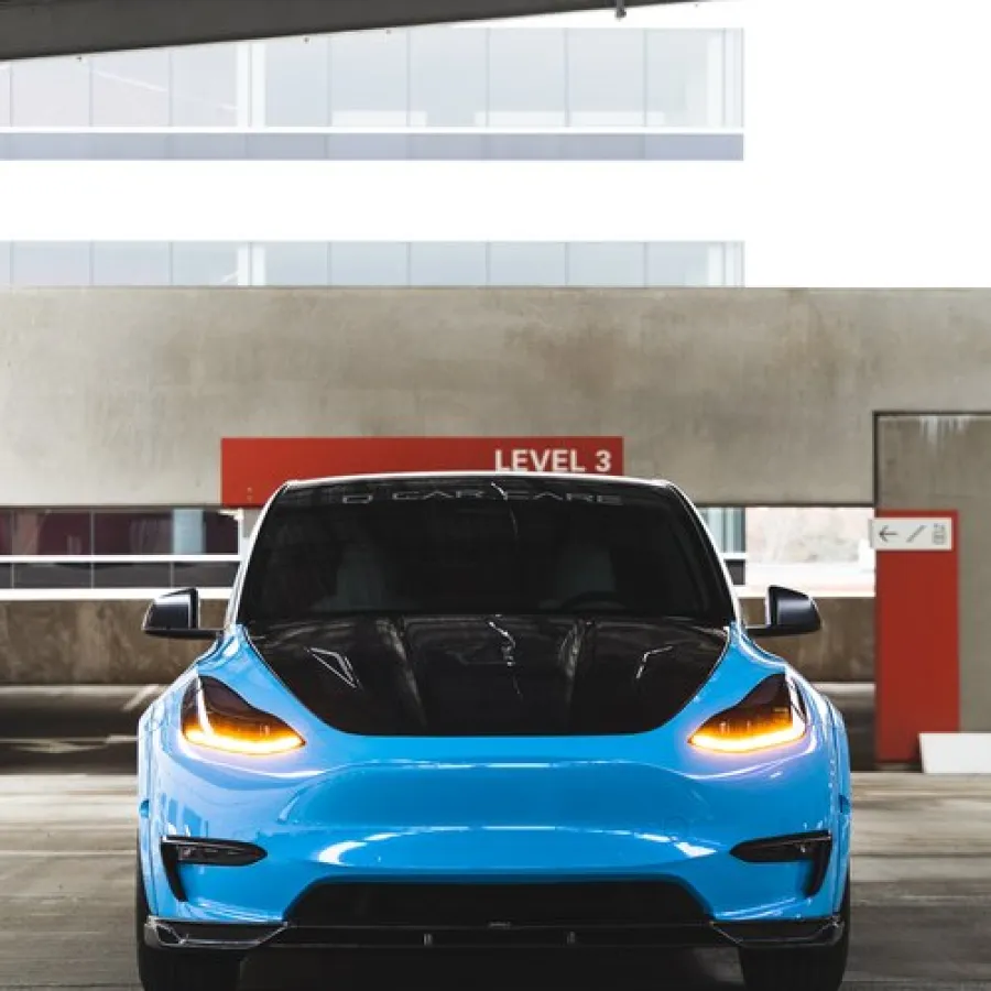 a blue car parked in a parking garage