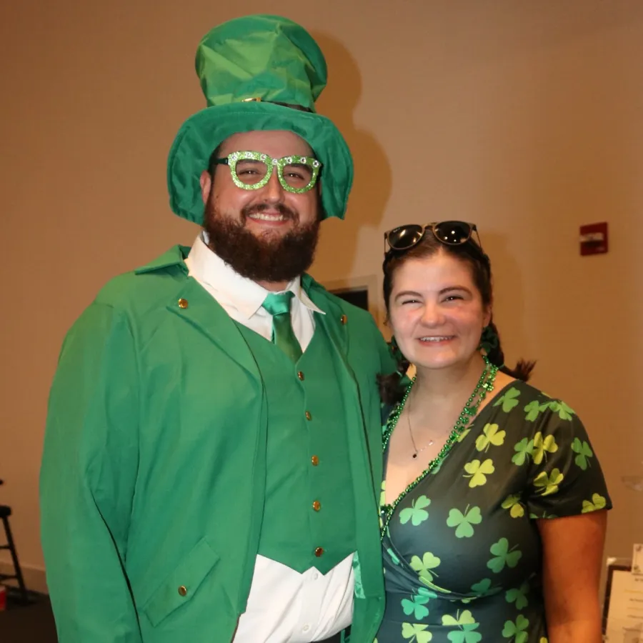 a person wearing a green hat and a green shirt