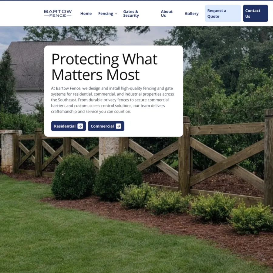 Wooden fence with diagonal cross braces enclosing a garden with neatly trimmed shrubs and lawn