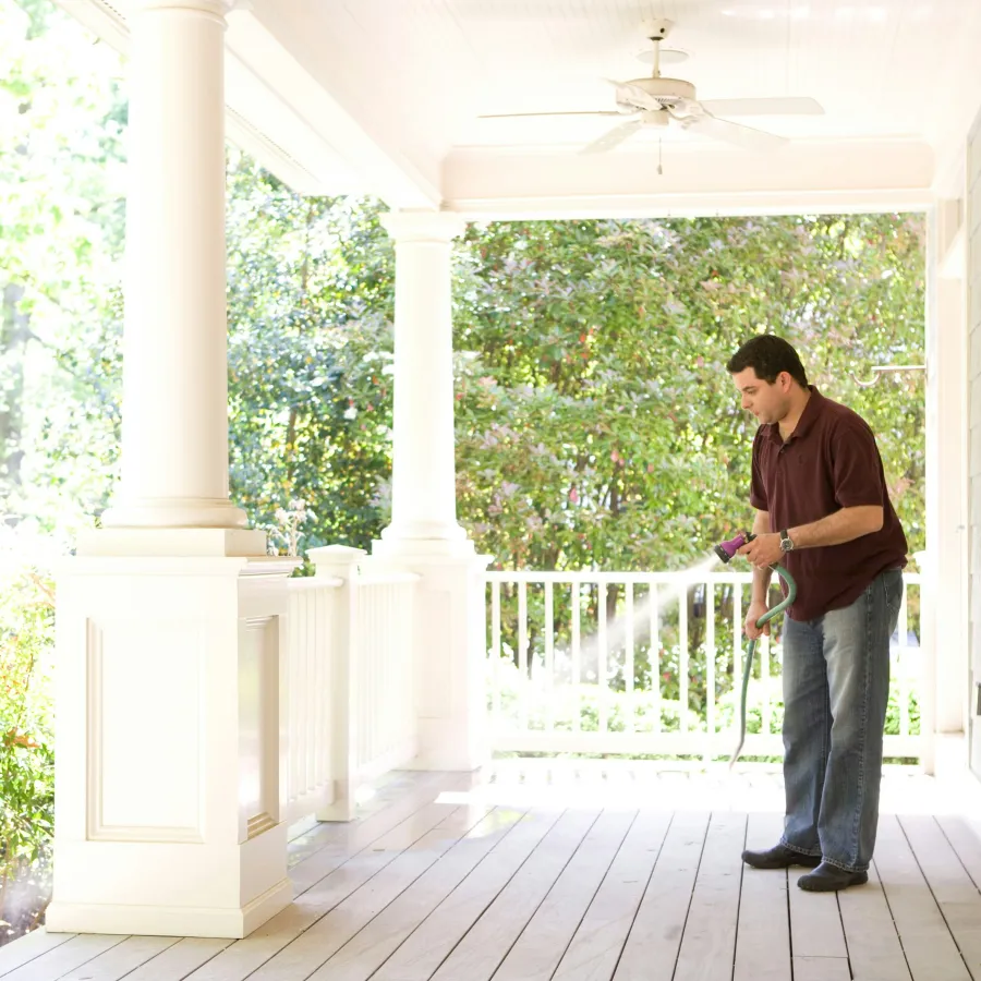 a man standing on a porch