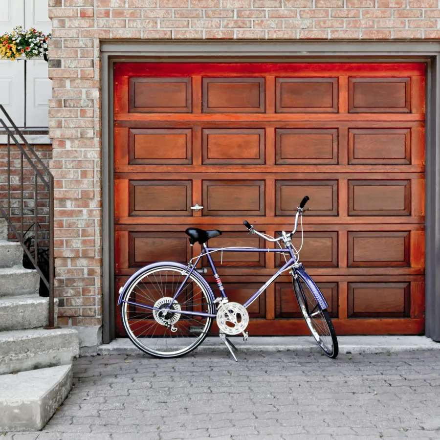 a bicycle parked in front of a door