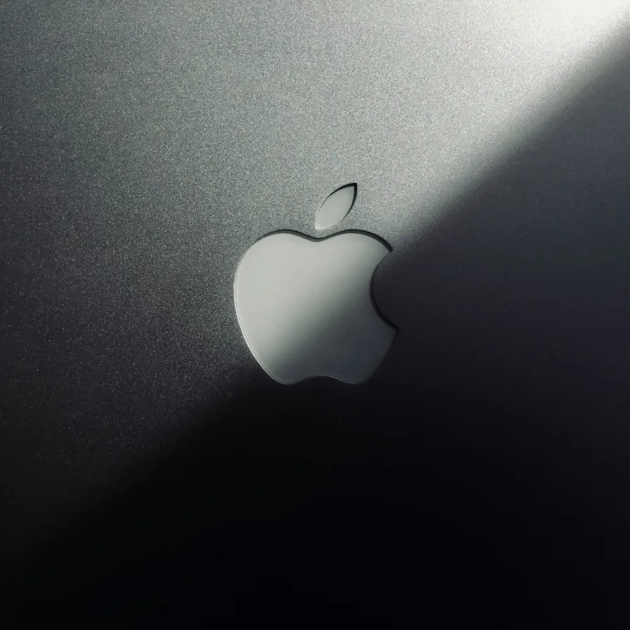 a white apple on a white surface