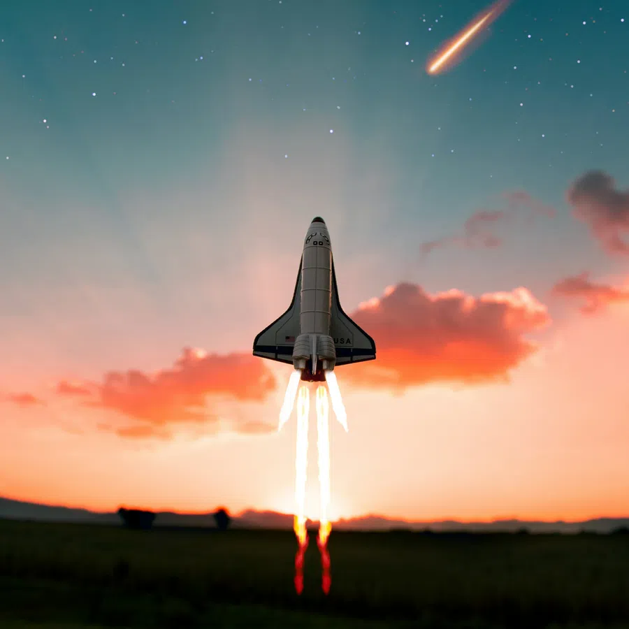 Space shuttle launching into starry sky with fiery thrusters against a sunset backdrop and shooting star.