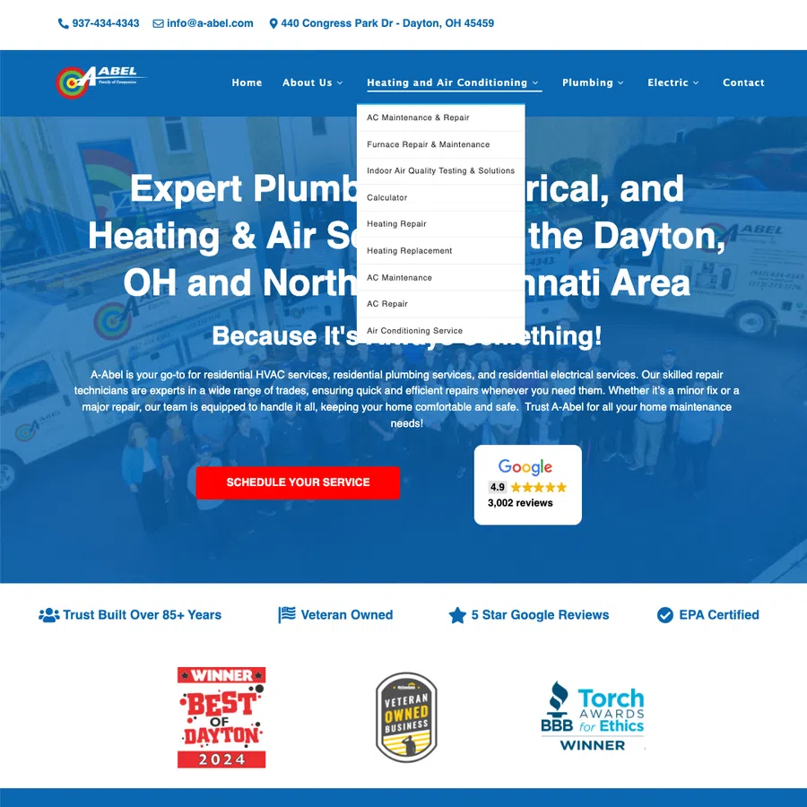 A-Abel website homepage showing HVAC, plumbing, electrical services in Dayton with contact info and awards