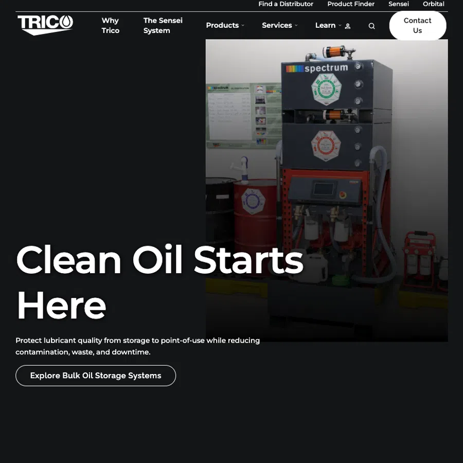 Industrial oil filtration system labeled Spectrum with drums and control panel in a clean facility setting.