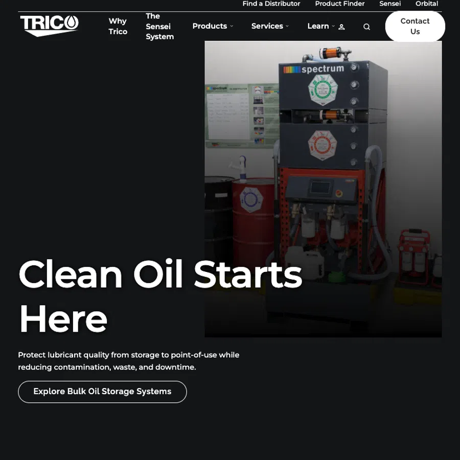 Industrial oil filtration system with labeled barrels and control panel for clean lubricant storage and processing.