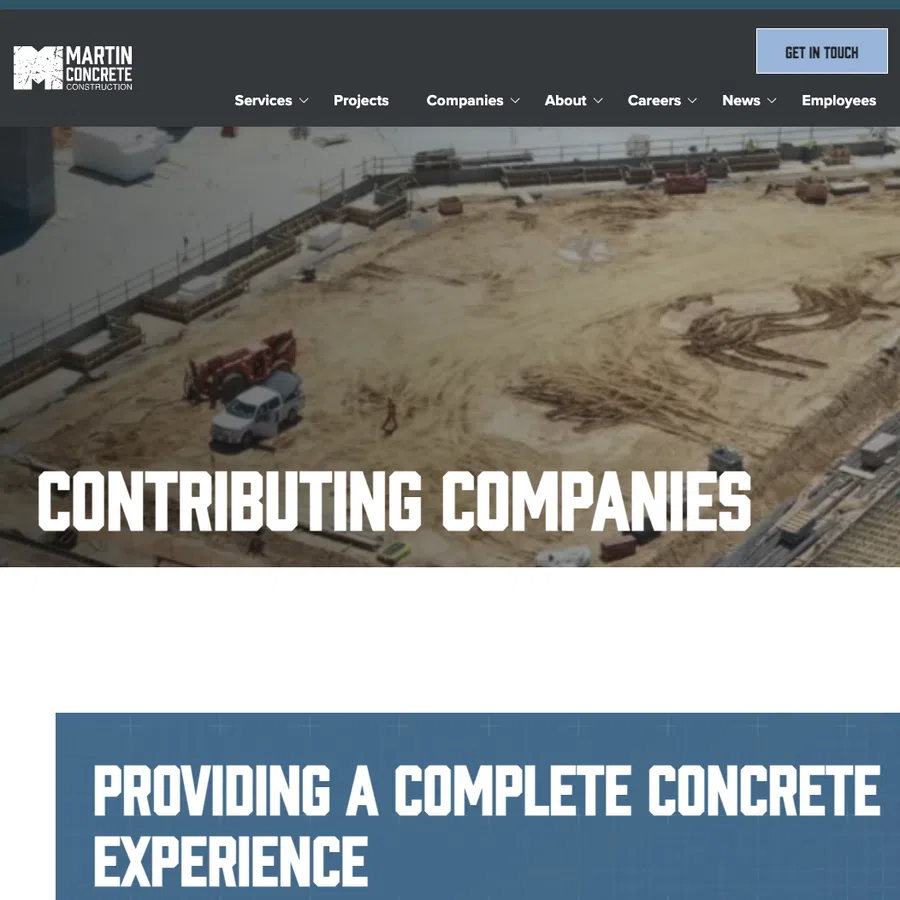 Construction site with vehicles and foundation work showcasing contributing companies in concrete construction.