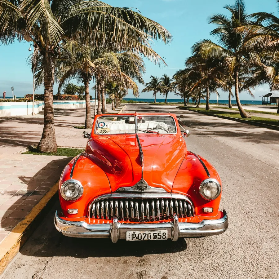 a red car parked on a road