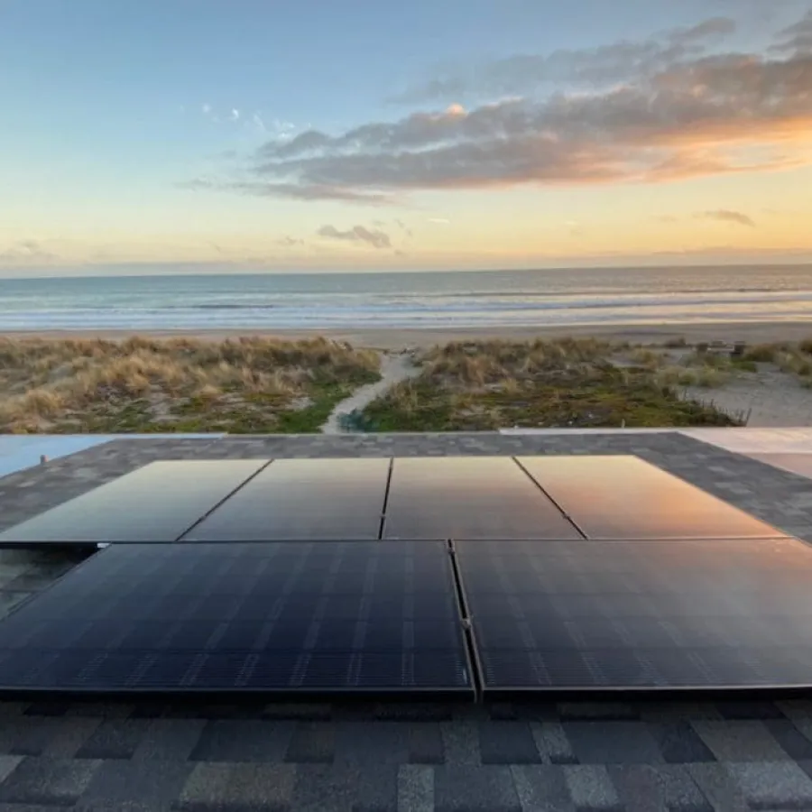 a wood deck overlooking a beach