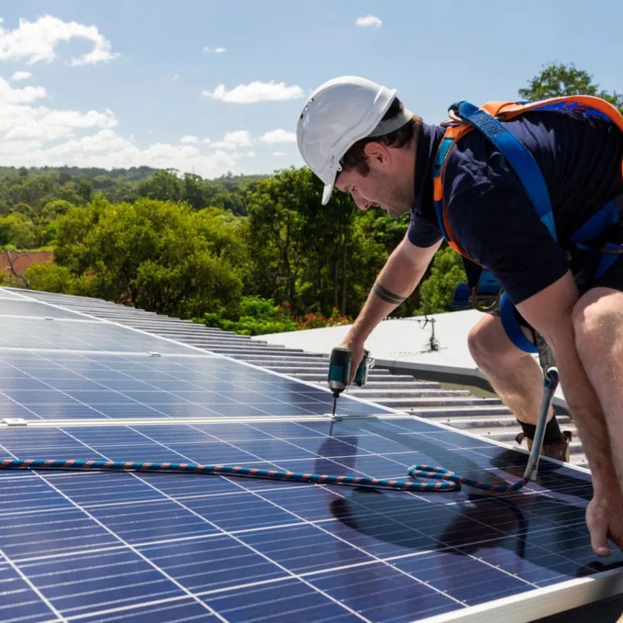 a man working on a solar panel