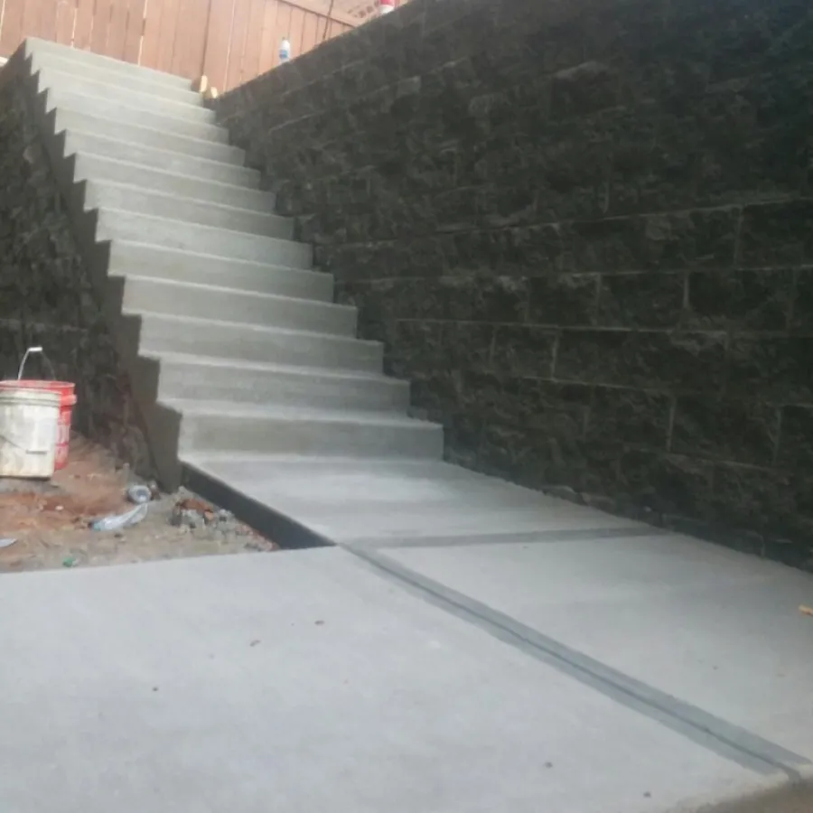 a stone staircase with a brick wall