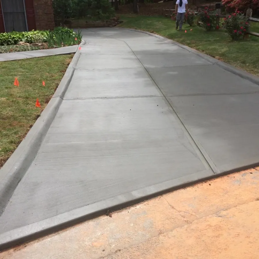 a sidewalk with a concrete walkway