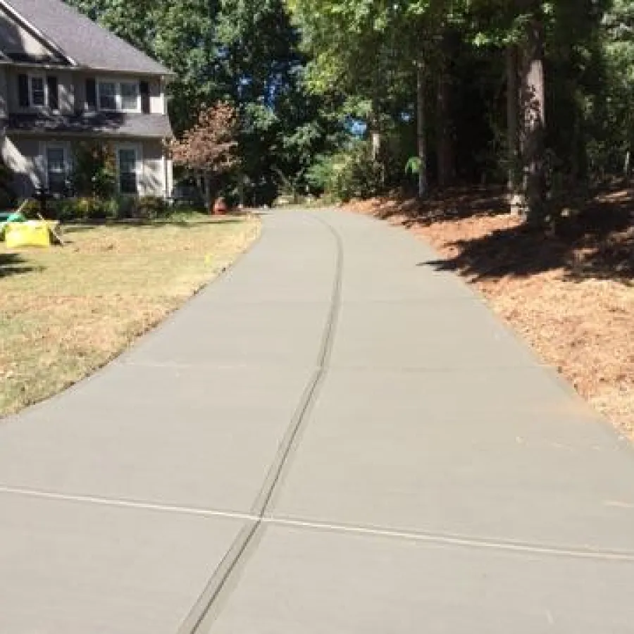 a road with trees and grass