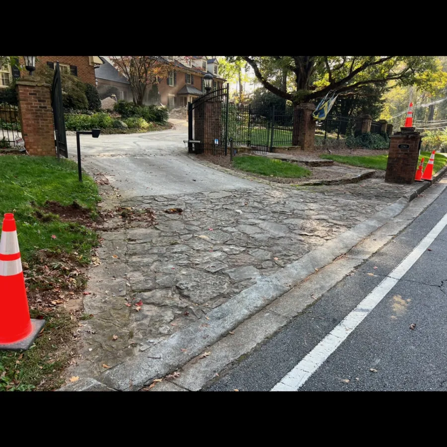 a road with a fence and trees