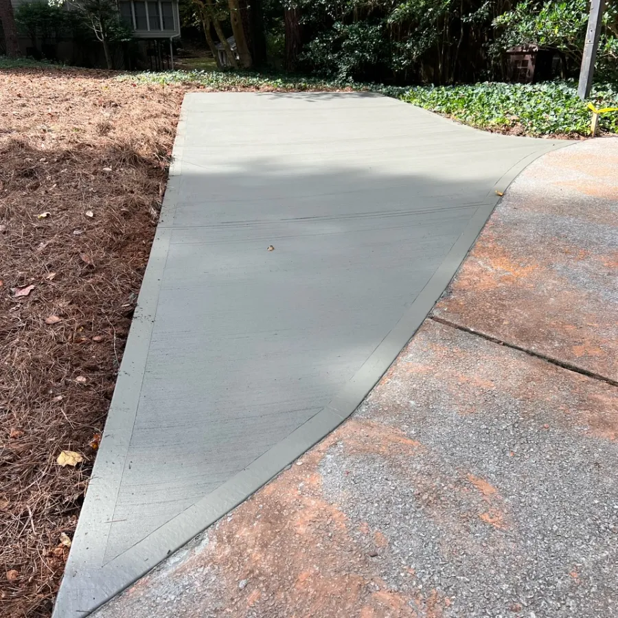 a sidewalk with a sidewalk and trees