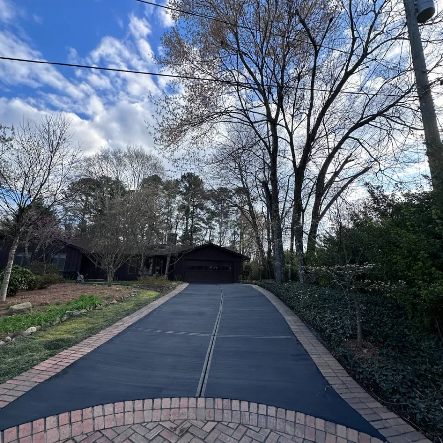 a paved road with trees on either side of it