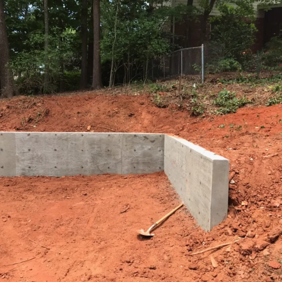 a concrete structure in a dirt area