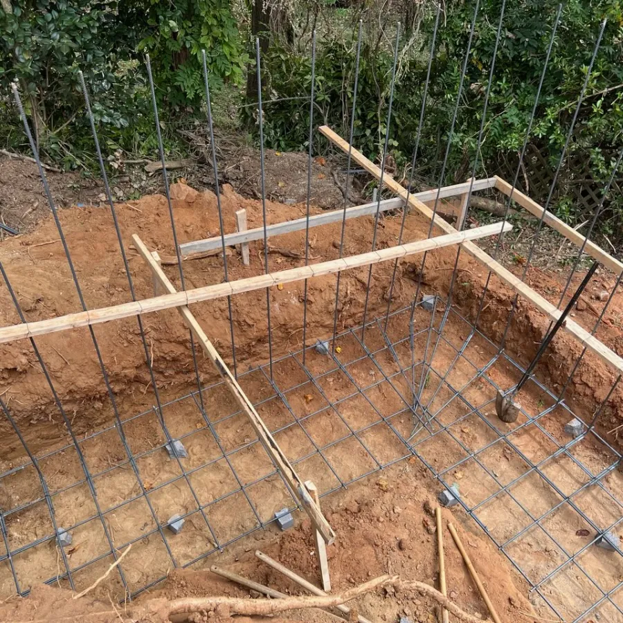 a wooden foundation with a fence