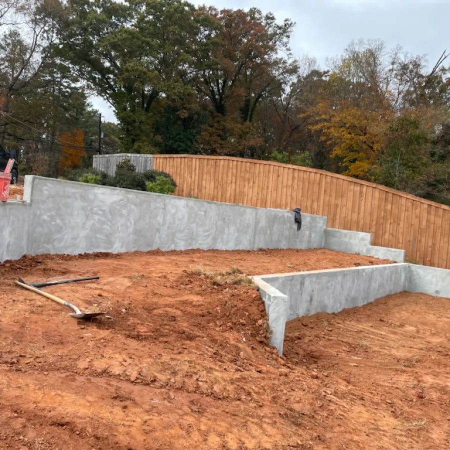 a white bench in a dirt area