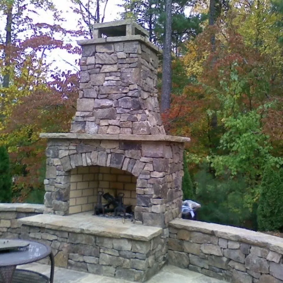 a fireplace in a stone wall