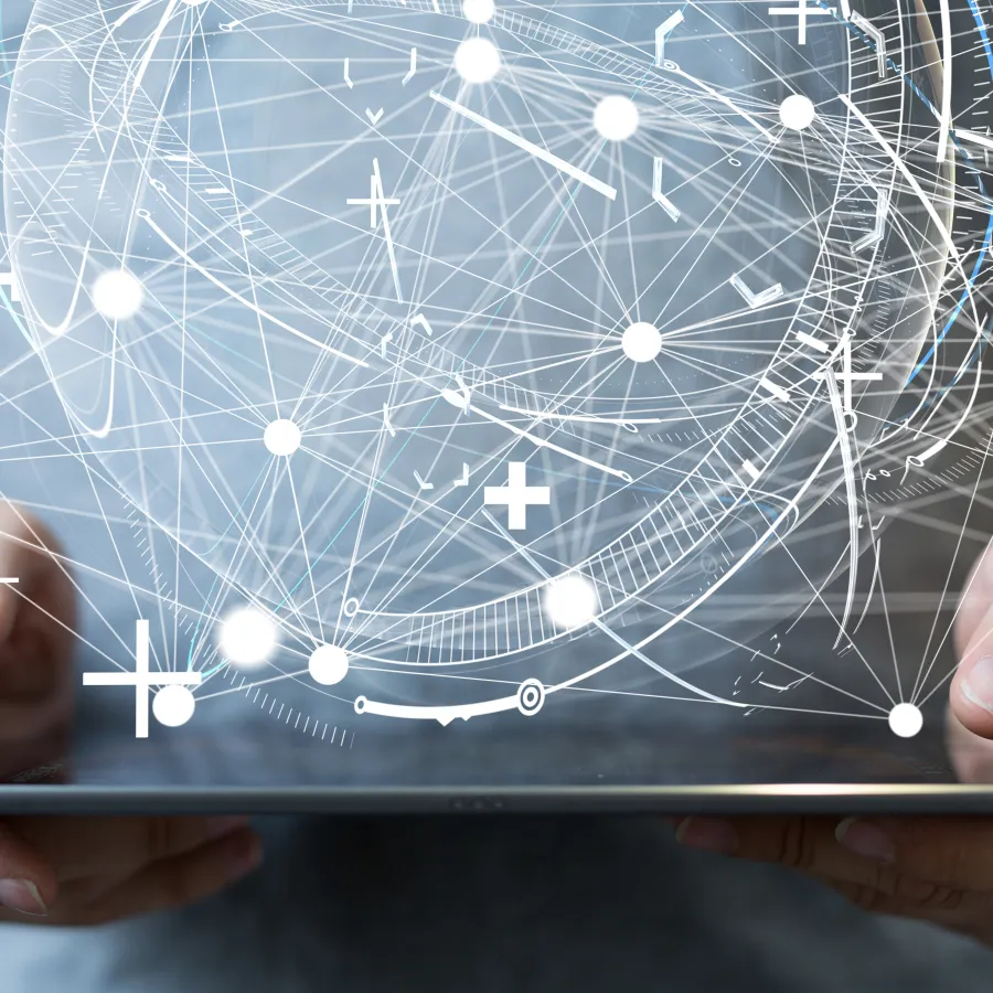 Person holding a tablet with abstract digital graphics and connections floating around.