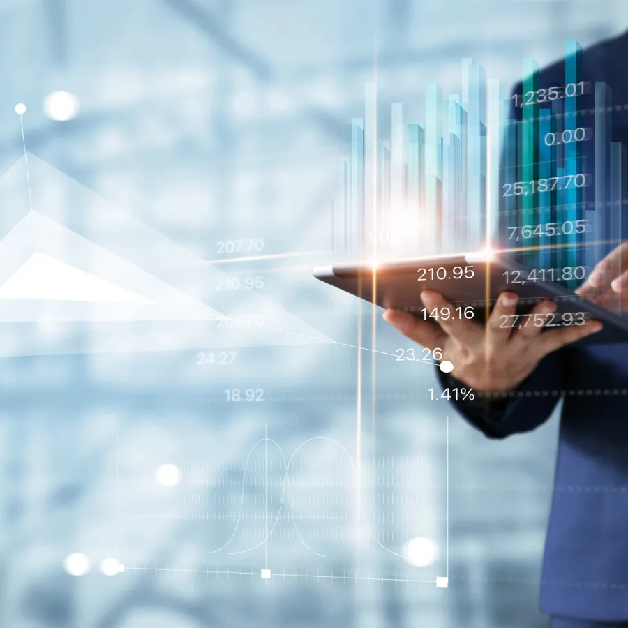 Business professional analyzing digital financial data on a tablet with graphs and trends.