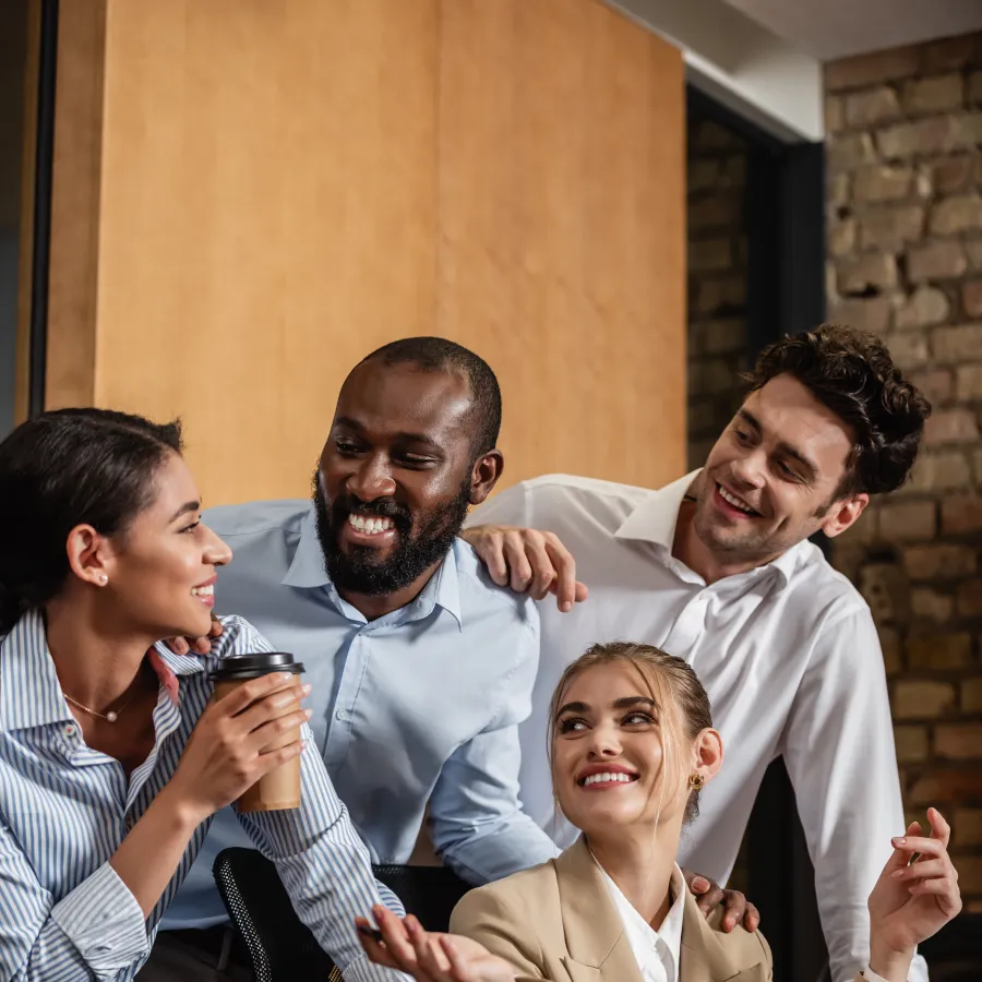 Diverse professionals enjoying a brainstorming session in a modern office environment.