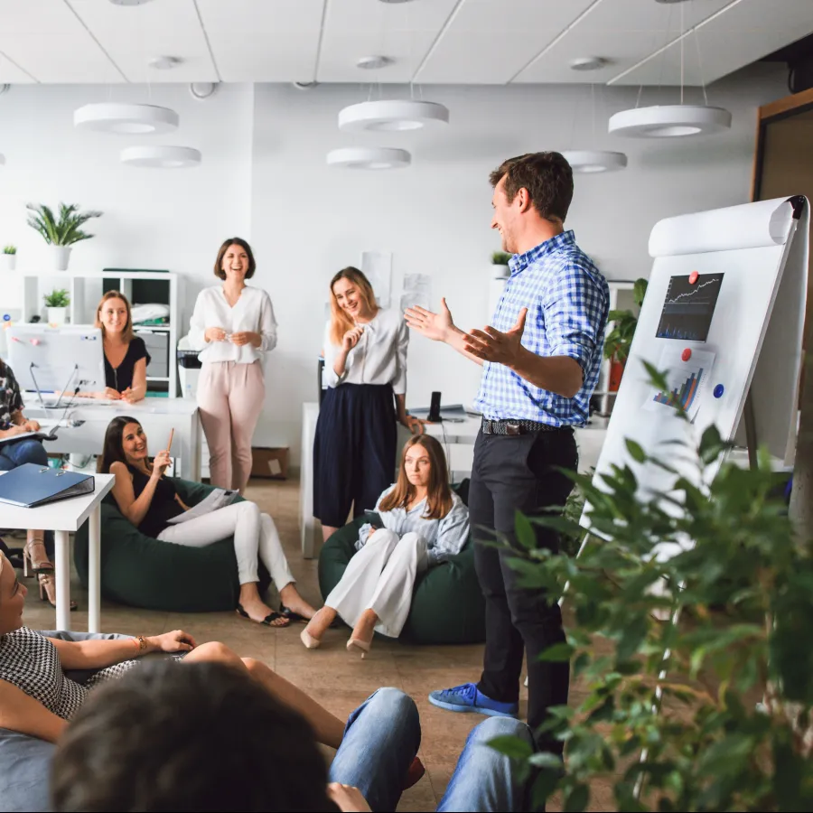 A dynamic office meeting with diverse professionals engaged in a discussion.