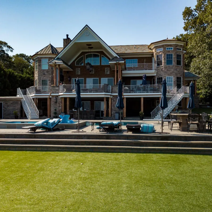 a large house with a lawn and a large front yard