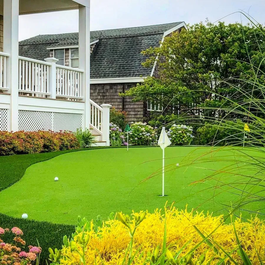 a golf course in front of a house