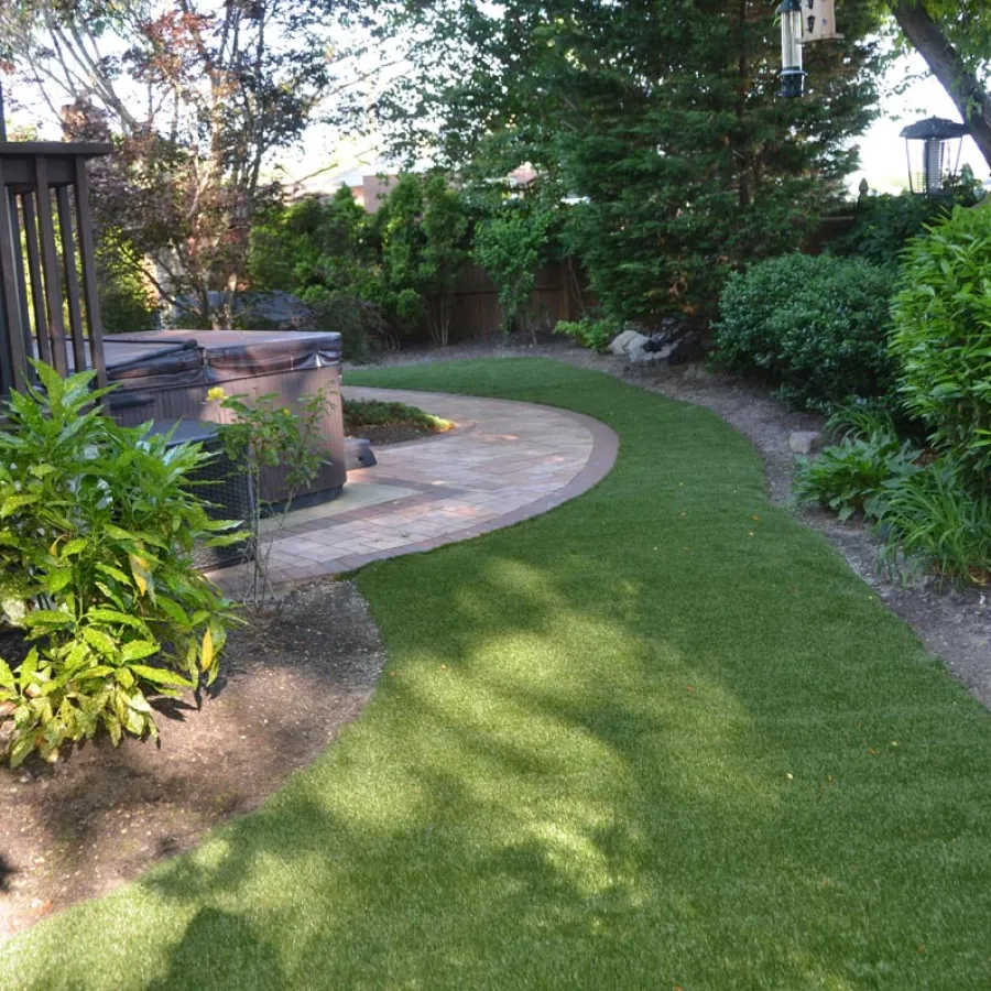 a backyard with a small pond