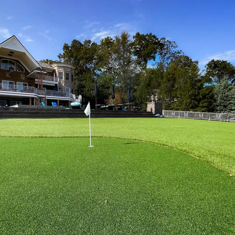 a golf course with a building in the background