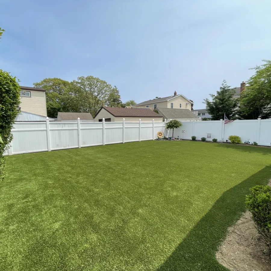 a fenced yard with a white fence and a white picket fence