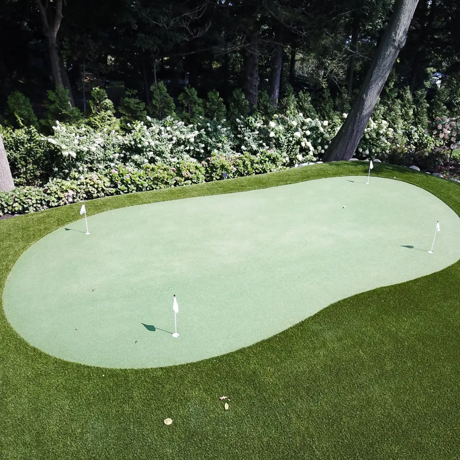 a golf ball on a green golf course