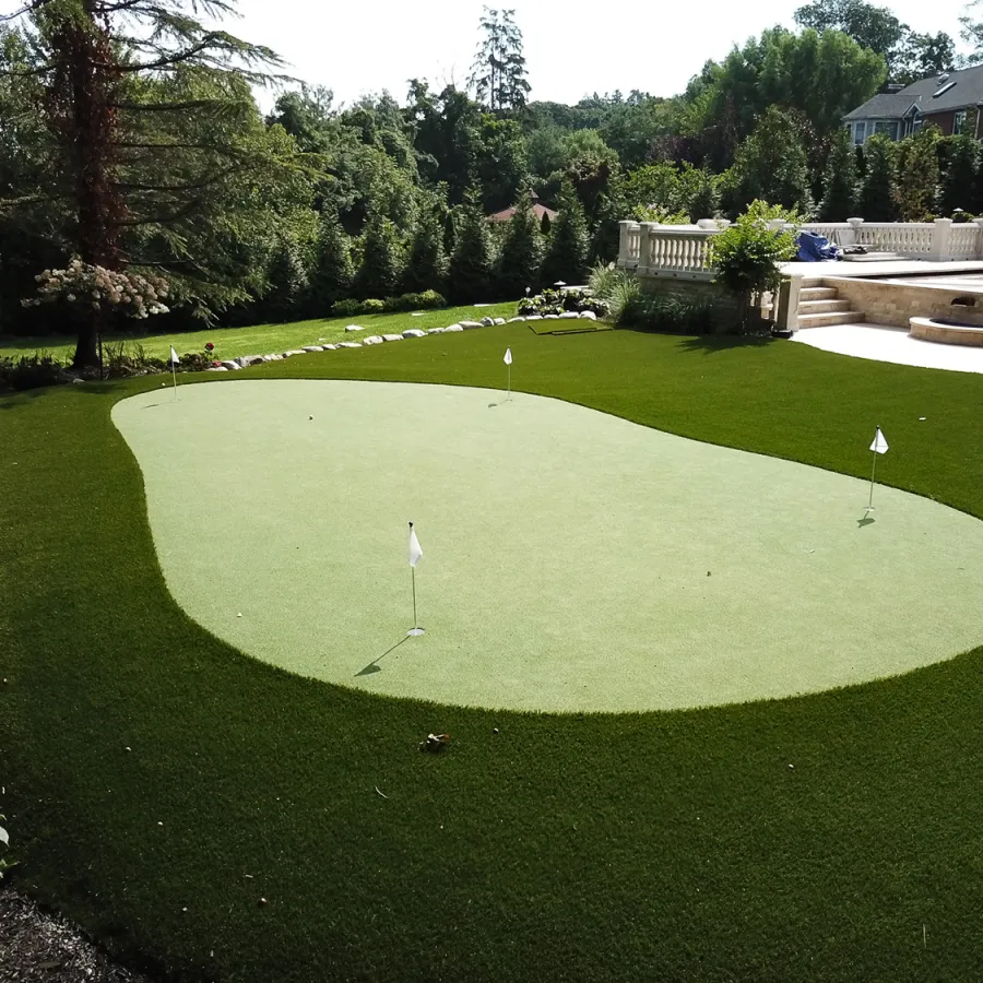 a golf course with a green field