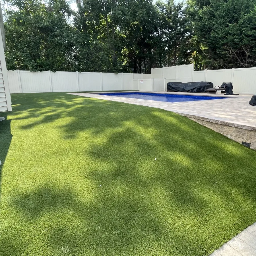 a backyard with a pool and a deck