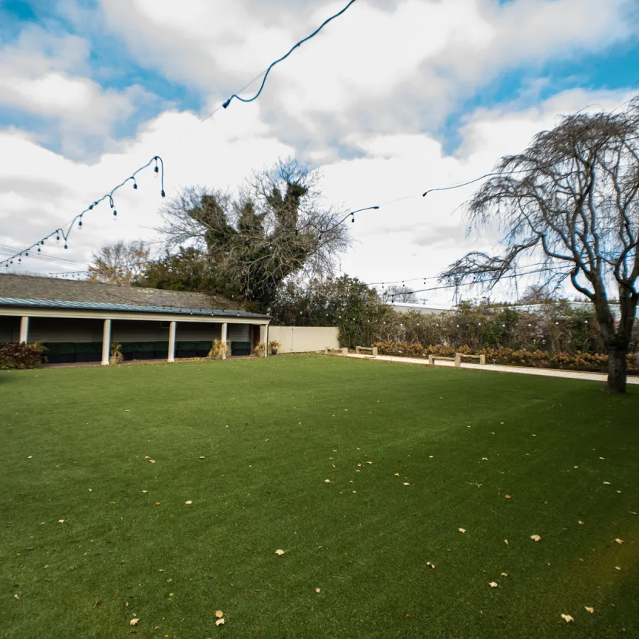 a building with a grass yard