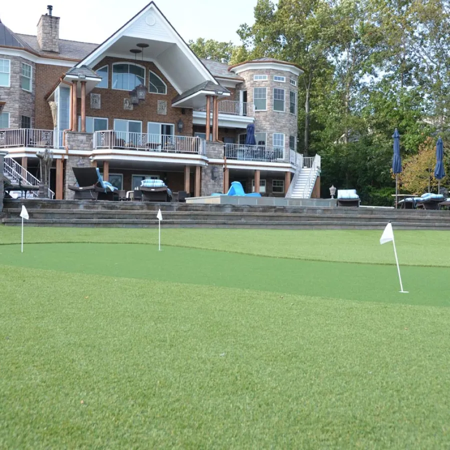 a golf course in front of a house