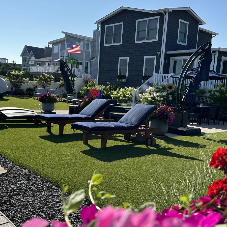 a backyard with a picnic table and chairs
