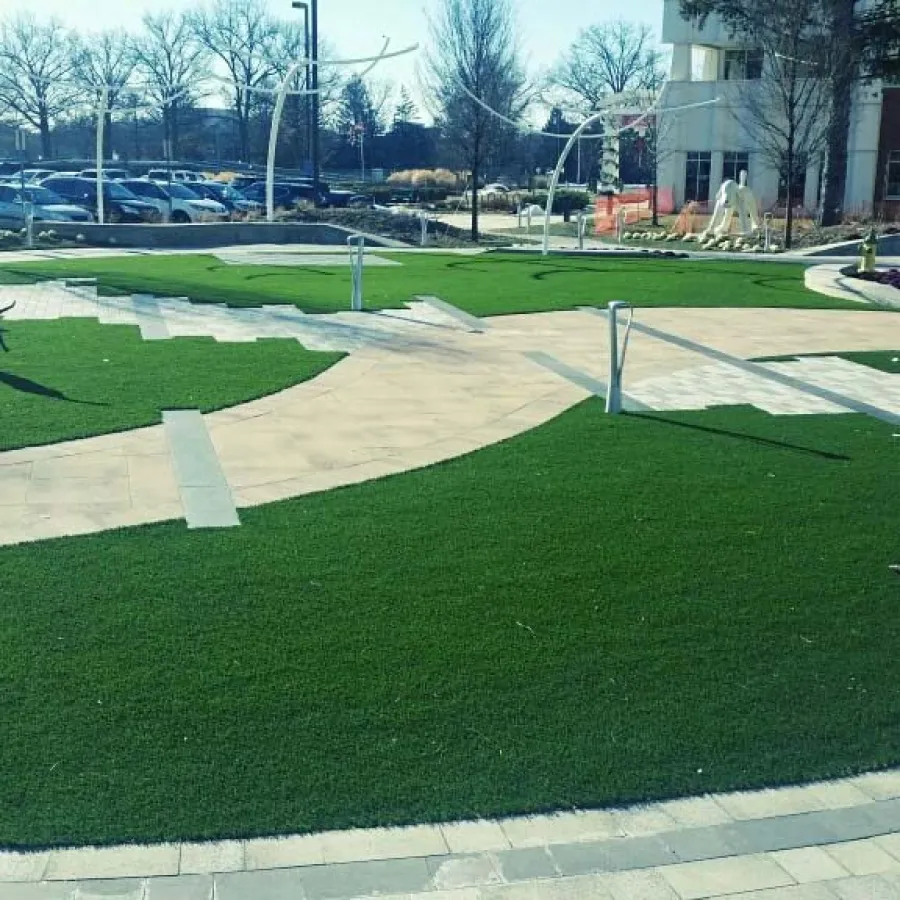 a person walking on a grass field