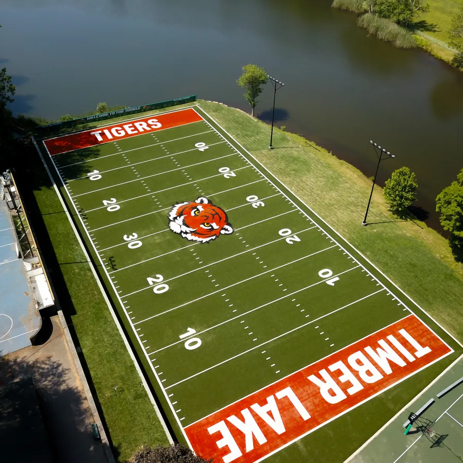 a football field with a red car
